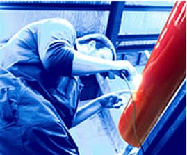 Roller being machined on the grinding bed